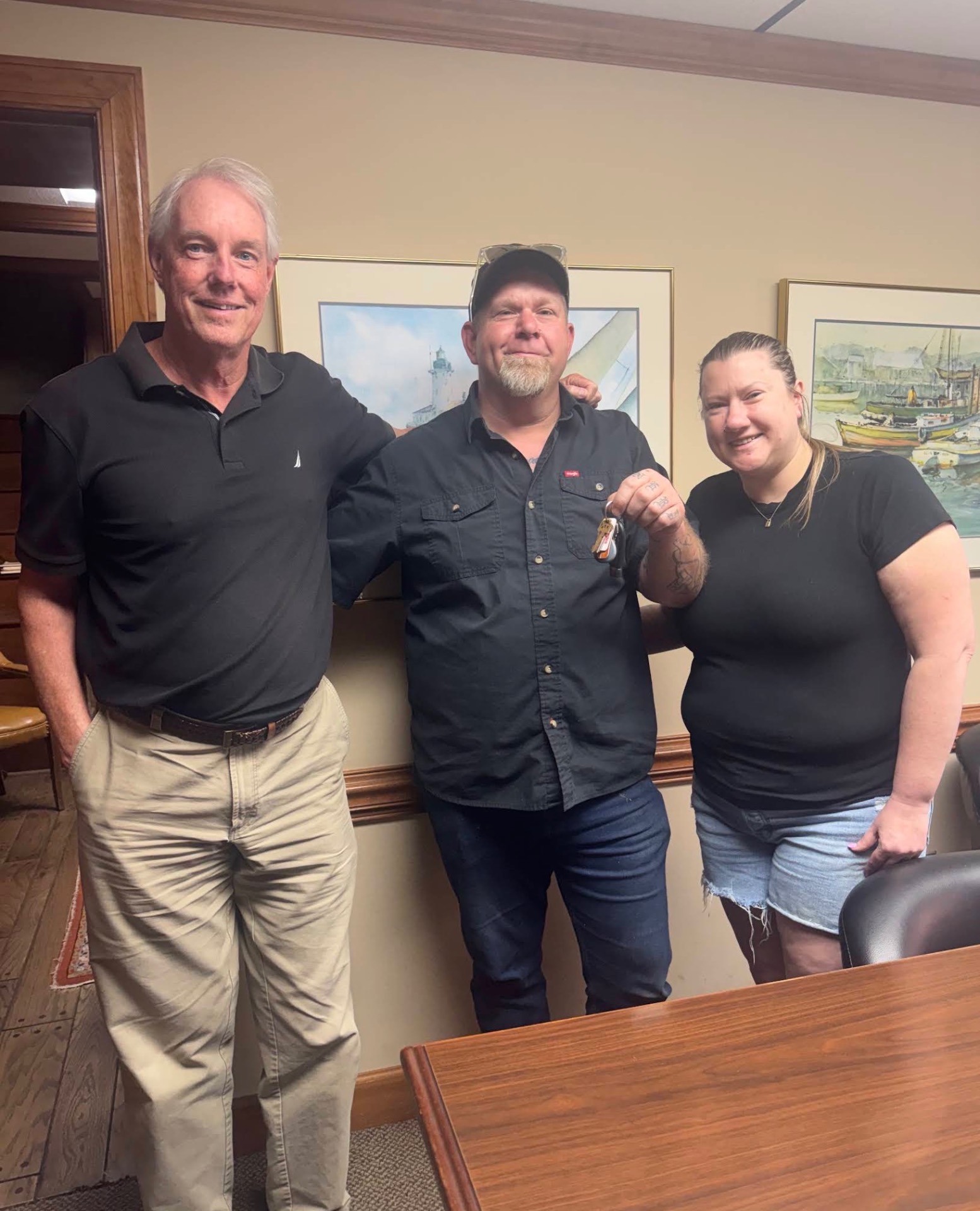 Buyers receiving the keys to their new home at closing